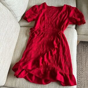 Flowy little red wrap around dress.